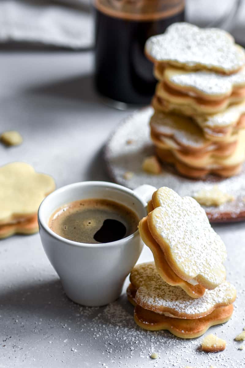 Lemon Biscuits shown next to a cup of coffee.