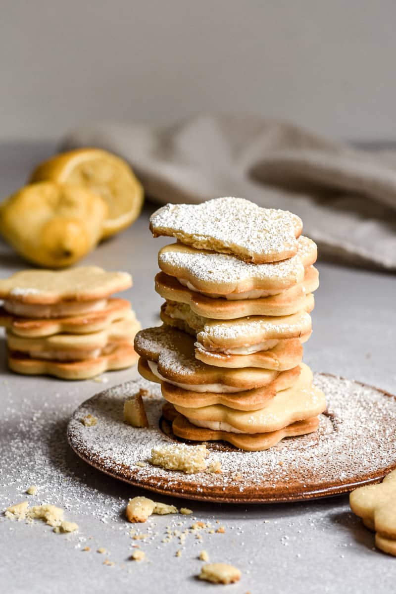 Lemon Biscuits shown stacked on a side plate.