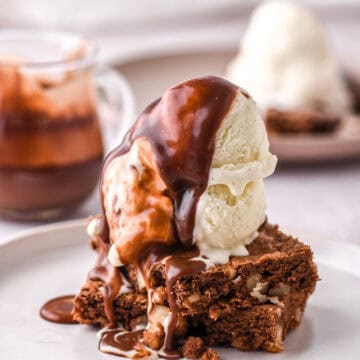 Brownie Hot Fudge Sundae shown on a hite plate.