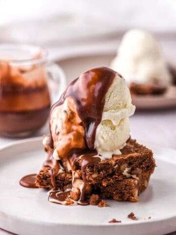 Brownie Hot Fudge Sundae shown on a hite plate.