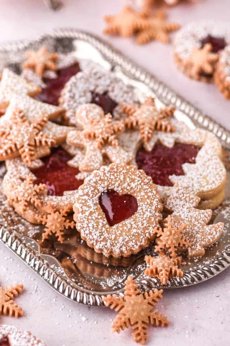 Christmas Butter Cookies of different shapes shown on a silver tray.