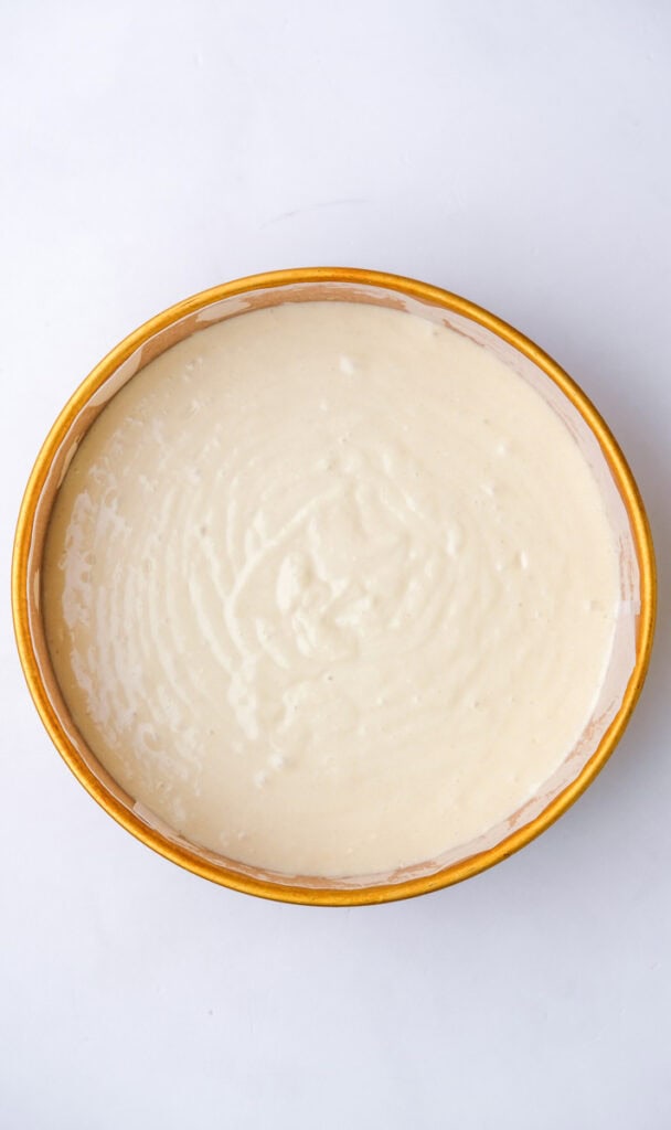 Image showing step 7, the batter in a cake pan before baking.